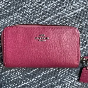 COACH small pink leather wristlet wallet.